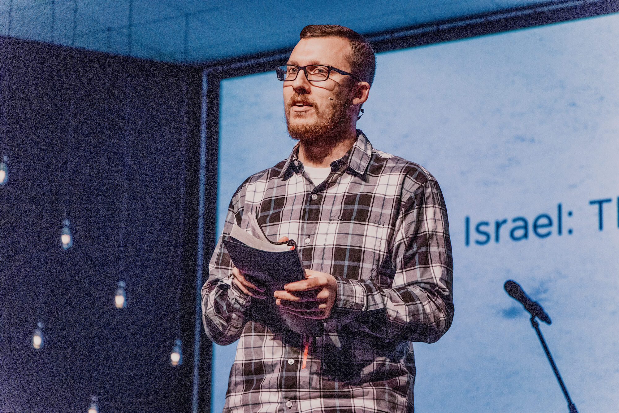 Brandon Kelley Preaching - with Bible - Daily Devotional